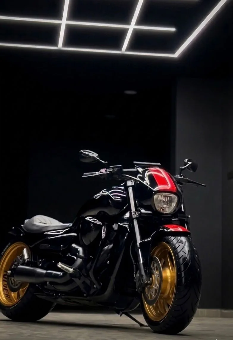 Custom bike with gold wheels after professional detailing at Dust Defender Lab